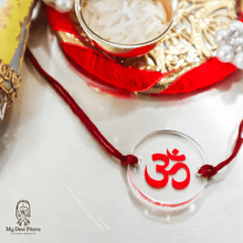 Load image into Gallery viewer, Close-up of clear acrylic Om symbol rakhi charm with printed name personalization