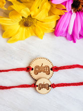 Load image into Gallery viewer, Engraved gaming controller rakhi pendant on thread bracelet