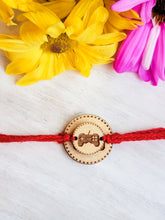 Load image into Gallery viewer, Gaming controller rakhi design close-up showing engraving detail