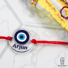 Load image into Gallery viewer, Close-up of evil eye rakhi pendant with custom name detail