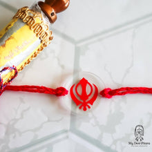 Load image into Gallery viewer, Khanda rakhi on clear acrylic with red design and custom name