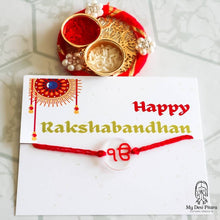 Load image into Gallery viewer, Khanda rakhi close-up showing engraved name detail