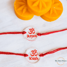 Load image into Gallery viewer, Personalized Om rakhi tied on wrist for Rakshabandhan celebration